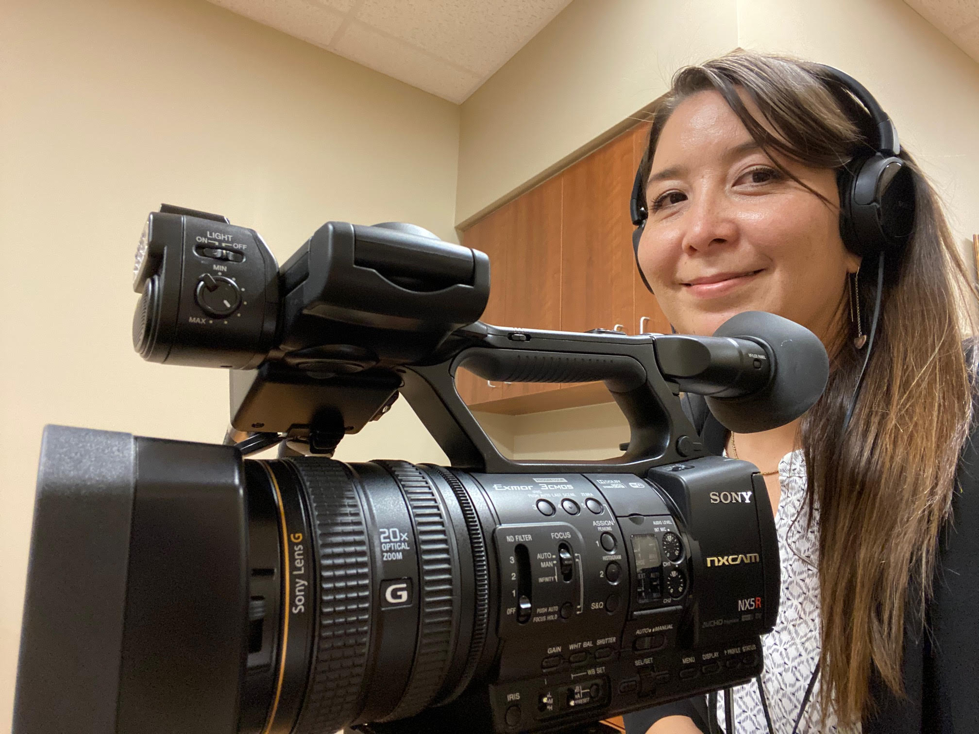 Staff member with a video camera